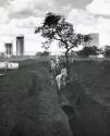 Builders and doctors in Brasilia: Brasilia, the most modern capital city in the world has 65,000 inhabitants in 1959. Today, its population totals 250,000. In three years this figure will increase to 500,000. Since the first foundations were laid, builders and doctors worked closely together, first of all to see to it that the 60,000 workers who took part in building the new city stayed in good health, then to prevent the town from being invaded by the diseases of bush and forest. Immigrants' health is checked systematically on the road into Brasilia, while specialists study the flora and fauna of the environment in order to discover possible sources of dangerous diseases. Building sights in the center of town.