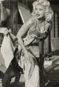 American actress Jayne Mansfield covering herself with a towel