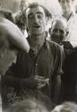 Man with cigarette in hand, at gypsy wedding, Saintes Maries de la Mer, France