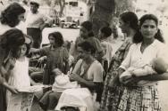 Gypsy women caring for their children, Saintes Maries de la Mer, France