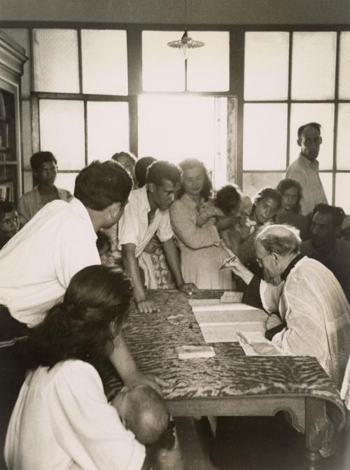 Gypsies signing up with the priest, Saintes Maries de la Mer, France