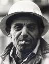 Portrait of construction worker in hard hat and with cigarette in mouth