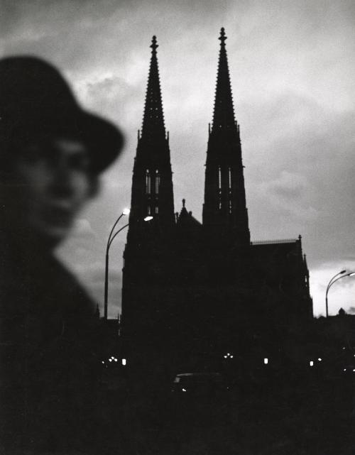 Church at dusk with figure in the foreground, Vienna, Austria