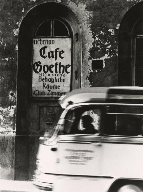 Bus driving by Café Goethe, Vienna, Austria