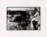 Boy pushing cart with pig, Saigon