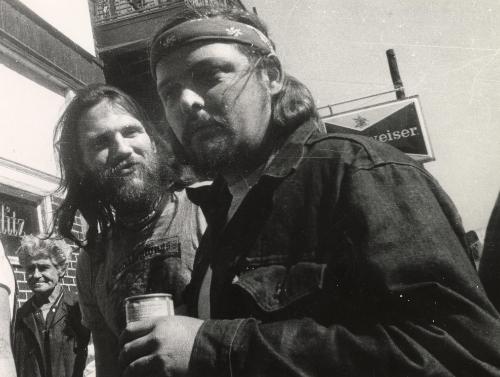 Portrait of biker drinking beer, New York City