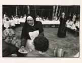 Nun offers crackers, village outside Warsaw, Poland