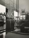 Street scene reflected in bank window, Chicago
