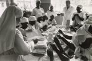 Women folding napkins, the Democratic Republic of the Congo