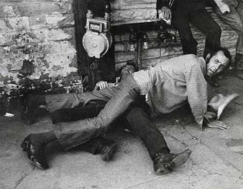 Men entangled on the street