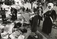 Market day: woman selling clothing, Lod