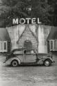 Motel with vintage car out front, USA