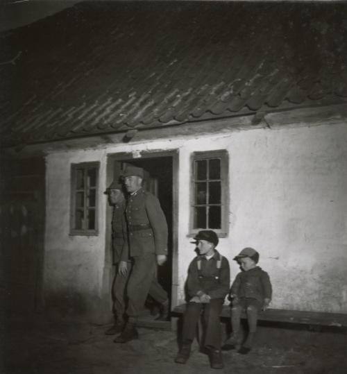 Untitled (Polish Army soldiers exiting a house), Poland