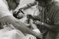 Injecting drug addict on stretcher at Bellevue Hospital, NYC