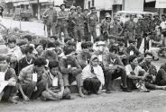 Vietnamese Troops Eject Communist Infiltrators From Saigon Area: the remaining members, 30 men and one woman, of the badly beaten Viet Cong 308th main force Battalion are shown in Cholon after their surrender to Government forces. Seated (front row, center) is Vo Thi My, a NVA woman liaison cadre. On her left is Nguyen Van Gac, operational staff officer for the battalion. Approximately 70 percent of VC main force units are North Vietnamese regular soldiers