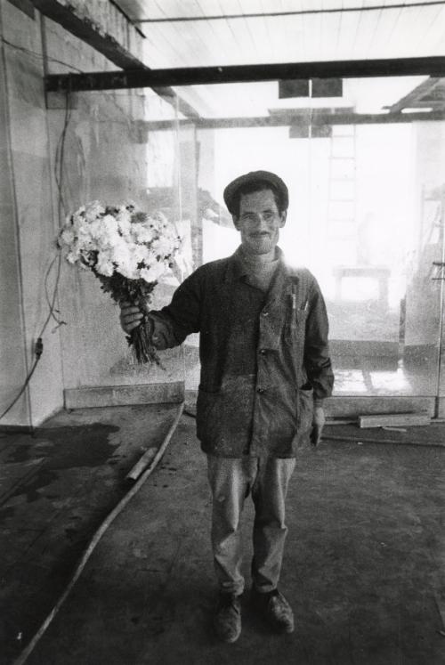 Azerbaijani worker holding bouquet, Tbilisi, Georgia