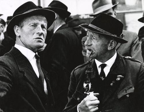 Two men in suits, one smoking ornate pipe, Salzkammergut, Austria