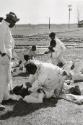 Prisoners working in the Cummins Unit or farm area of the Arkansas State Penitentiary fighting, Cummins, Arkansas