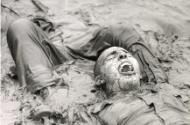 United States Marine Corp boot camp: "The Motivation Platoon". Recruits crawling through muddy swamp water as part of infiltration course