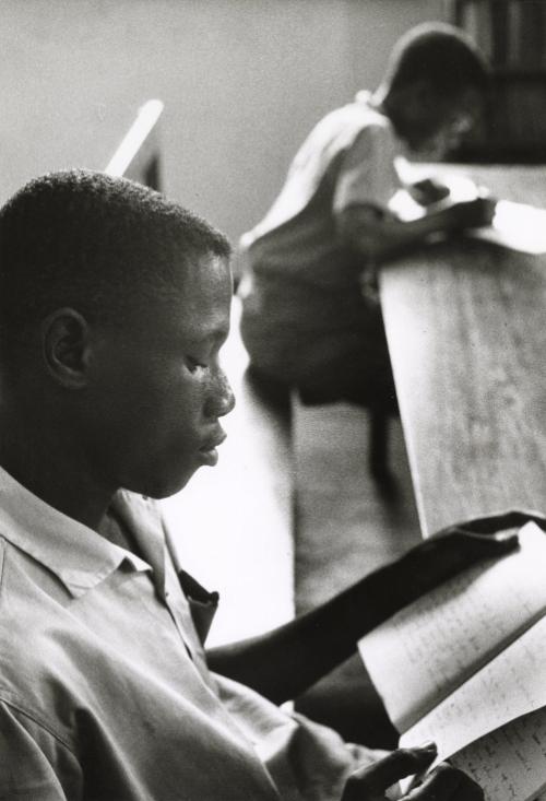 Boy reading, Ghana