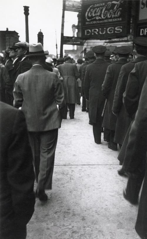 Men in line by drugstore