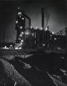 Night view of Elgin, Joliet and Eastern Railway train in factory, near Chicago