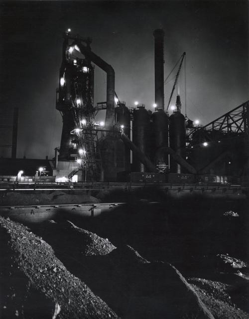 Night view of Elgin, Joliet and Eastern Railway train in factory, near Chicago