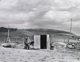 Farmer who abandoned his home and moved to a dugout near town to become eligible for relief, Grassy Butte, North Dakota