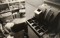 Homicide in a food store. The clerk was shot dead for the few dollars in the till, from the series "Police Work"
