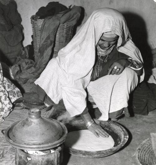 Wife preparing bread for her family at home, Morocco