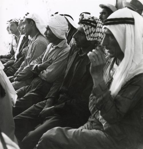 Men gather for a talk on health education, Middle East (likely Jordan)