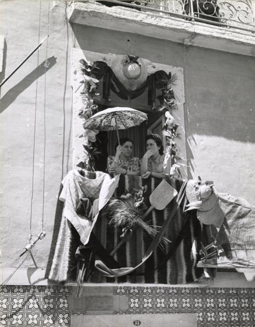 Women at their balcony during a festival, Spain