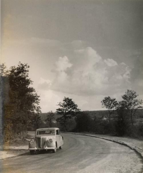 Untitled (Car on country road), France, from the "Roads" series