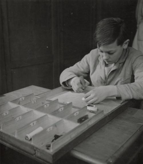 Untitled (Young boy doing woodworking), France