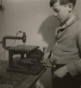 Untitled (Boy in woodshop), France