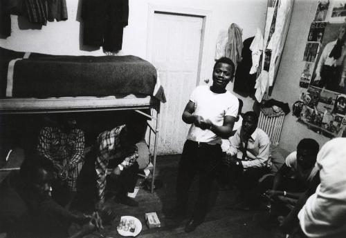 Group of black men in room with bunkbed