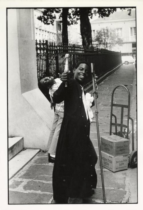 Portrait of black alter boy on sidewalk, USA