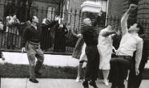 Jumping for beads, New Orleans, Louisiana, USA