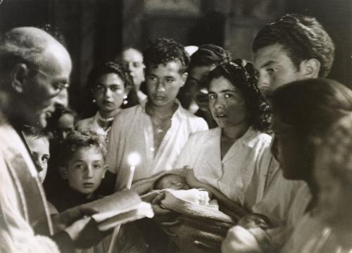 Priest giving the newborns of the gypsies blessing, Saintes Maries de la Mer, France