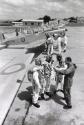 Group of pilots talking, Ghana