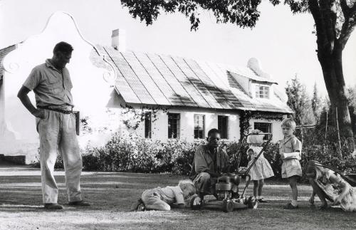 Black worker with blonde children and father