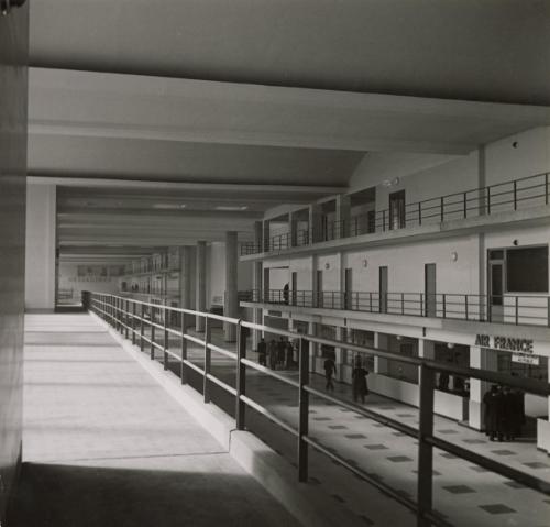 Paris Opens its New Airport at Le Bourget: The main hall of the aerodrome. Air companies represented by offices here include France, Great Britain, Germany, Switzerland, Italy, Holland, Belgium, both airmail and passenger services.