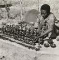 Ethiopian Jewish woman (Falascha) from a family of potters with pottery for sale on the road to Gondar, Ethiopia, Africa