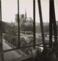 Back of Notre Dame Cathedral viewed through window, Paris