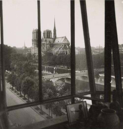Back of Notre Dame Cathedral viewed through window, Paris