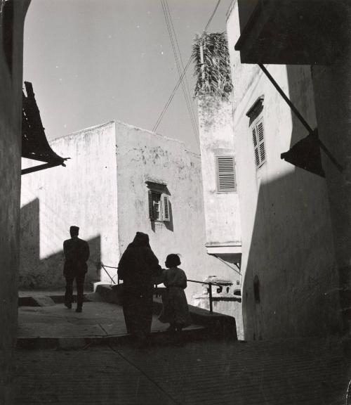 Street scene in Tangier. The native quarters of the city, known as Medina, is very old and characterized by narrow streets and low, two-story houses. Because of the heat, houses have only few, small windows, Morocco.