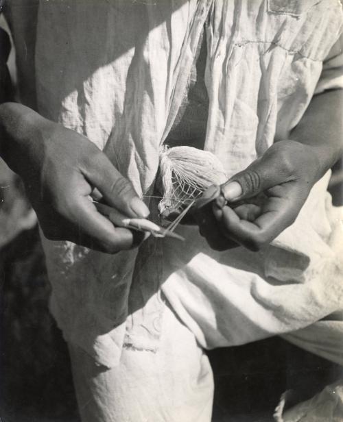 Making fishing nets, Mexico