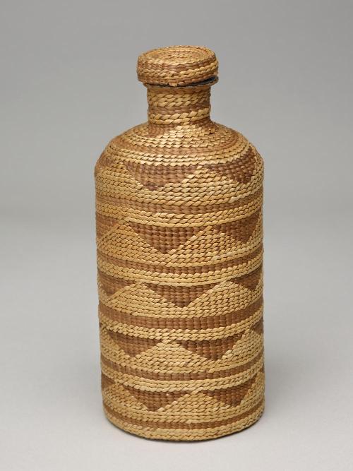 Basketry-covered glass bottle with lid