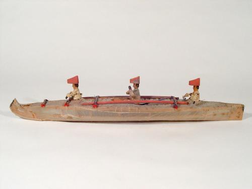 Model of a Bidarka boat with three seated figures