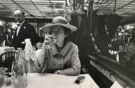 Mary McCarthy drinking from wine glass
